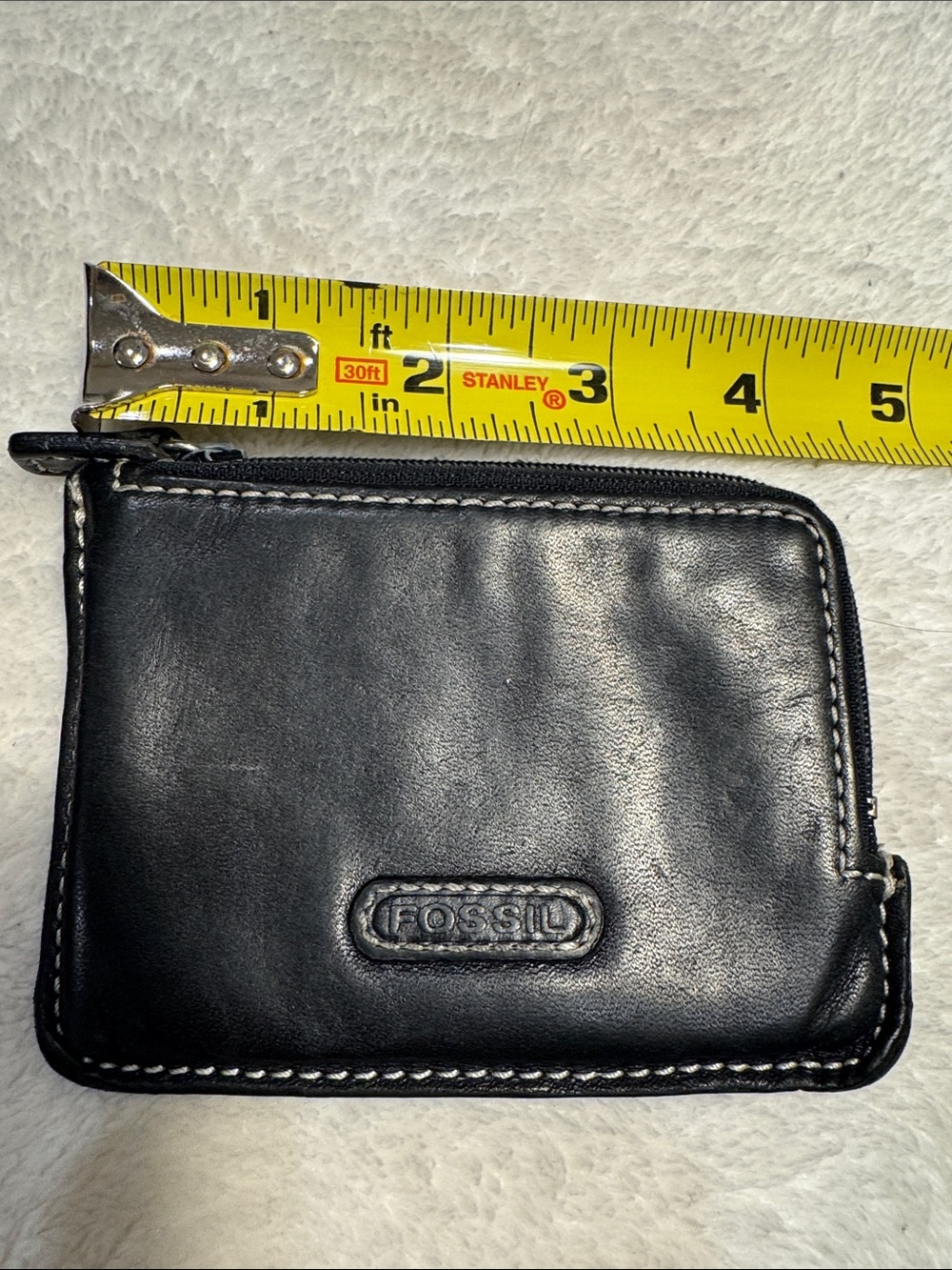 Fossil black leather mini wallet.